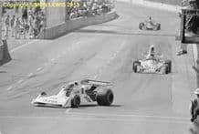 Surtees TS19 Alan Jones leads Laffitte's Ligier, 1976 Long Beach GP. photo