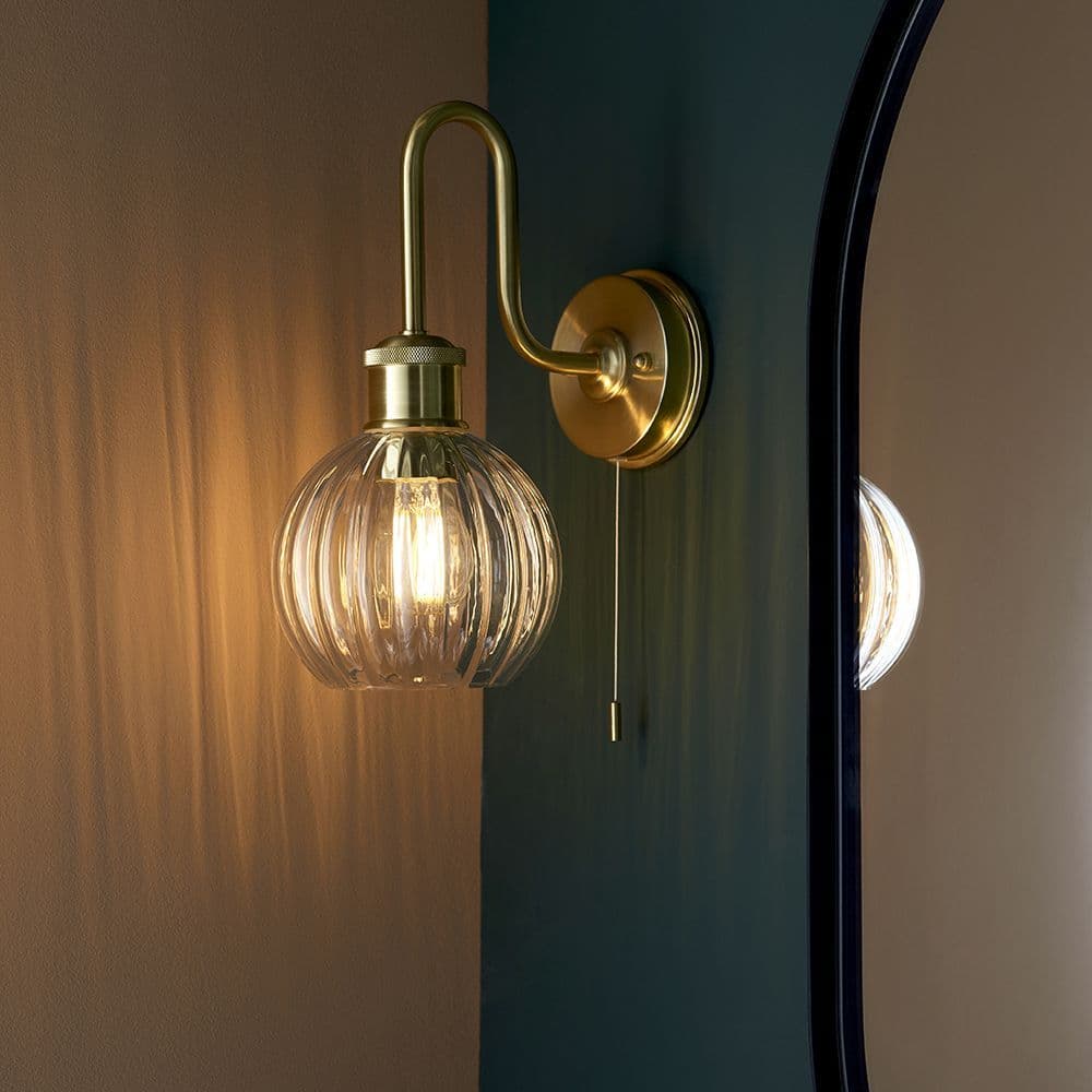 Agen Bathroom Wall Light in a Brushed Brass Finish with a Clear Ribbed Glass Switched IP44
