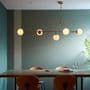 Bourges 5 Light Linear Pendant in a Matt Antique Brass Finish with Matt Opal Glass Shades