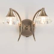 Radford Double Wall Light in an Antique Brass Finish with Clear Glass Shades, Switched