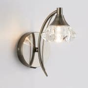 Radford Single Wall Light in an Antique Brass Finish with a Clear Glass Shade, Switched