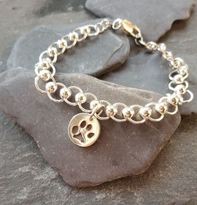 Silver circles bracelet with tiny pawprint charm