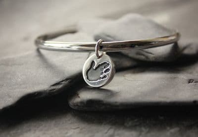 Solid Silver Bangle with Tiny Treasures handprint charm
