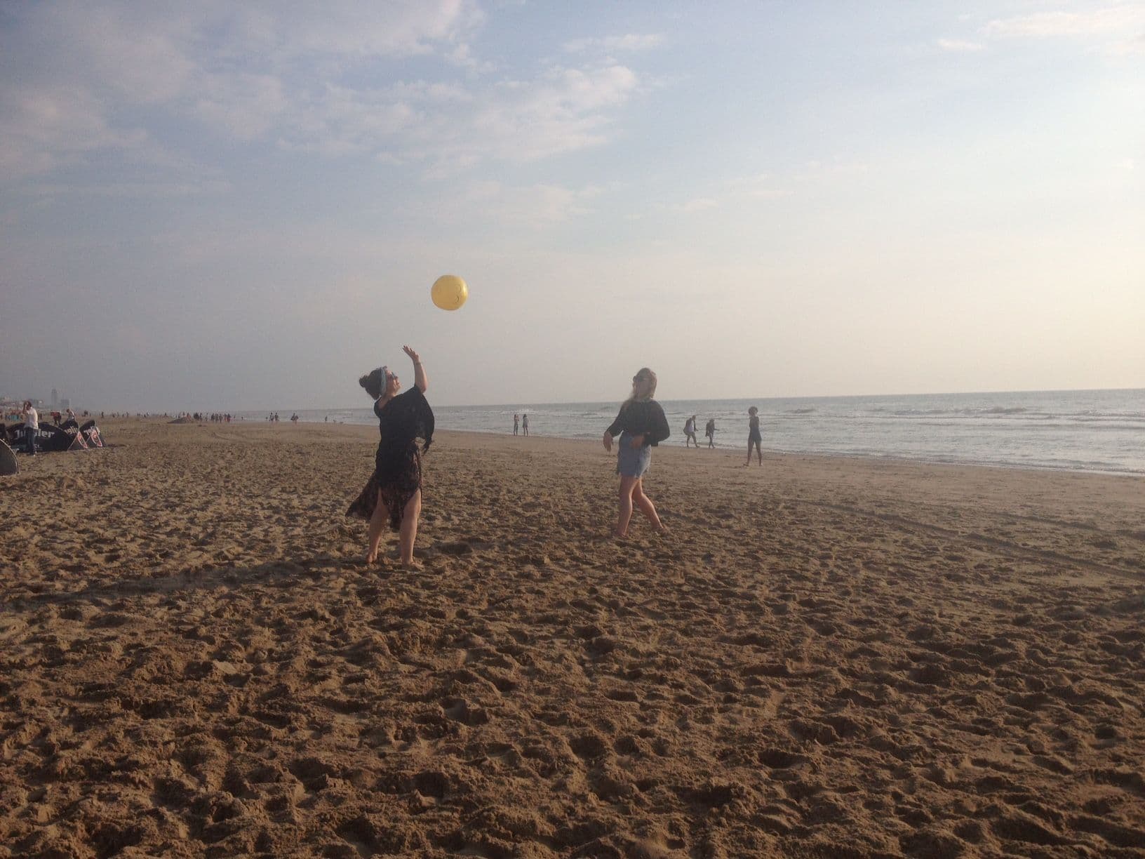 Emoji beach ball at beach throw