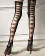 Eye-catching 30 denier stockings in black with criss-cross back