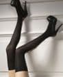 Eye-catching 30 denier stockings in black with criss-cross back