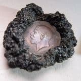 BRITISH PENNY SET IN VOLCANIC LAVA THOUGHT TO BE FROM THE 1944 ERUPTION OF VESUVIUS