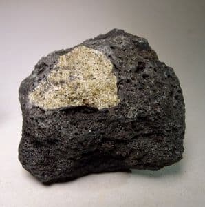 OLIVINE XENOLITH IN LAVA  -  Hawaii, USA