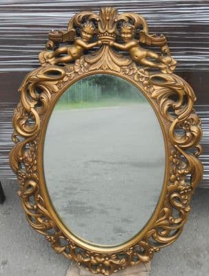 Gilt Ornate Carved Oval Wall Mirror by EC Gomme