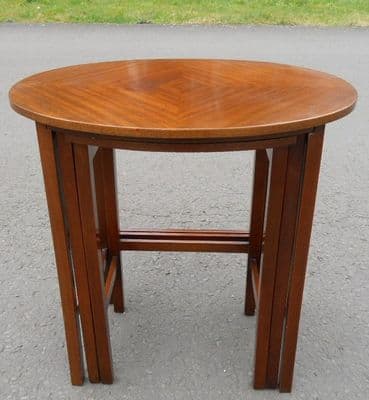 Oval Nest of Three Mahogany Coffee Tables