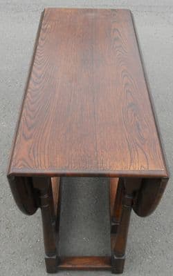 SOLD - Polished Oak Gateleg Table to Seat Four