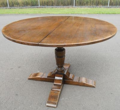 SOLD - Round Oak Pedestal Extending Dining Table to Seat Eight