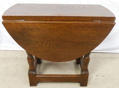 sold - Solid Oak Oval Dropleaf Coffee Table