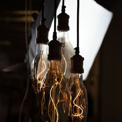 Four Bare Bulb Flambeau Cluster Ceiling  Pendant  in Blackened Rust