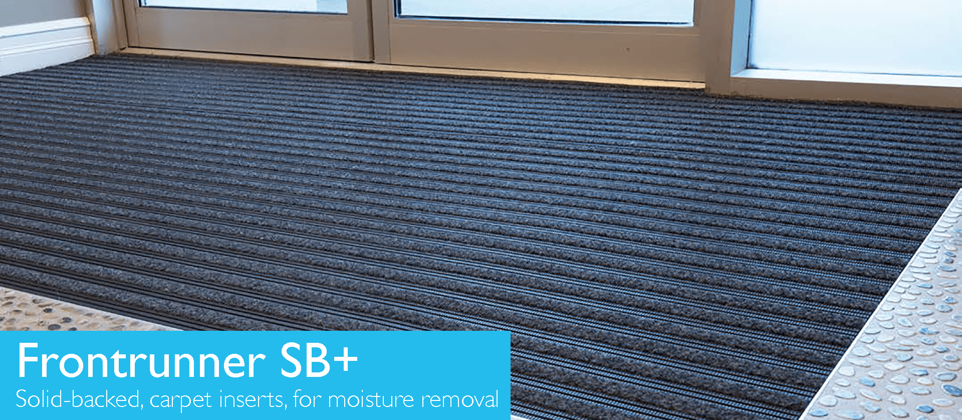 Solid backed matting entrance with carpet inserts