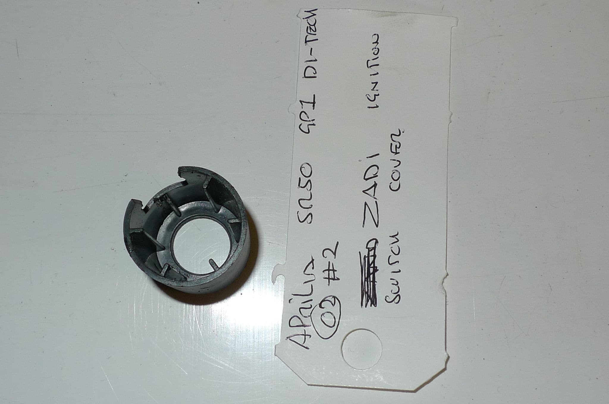 APRILIA SR50 GP1 DI-TECH ZADI IGNITION SWITCH COVER 2 LOC-A